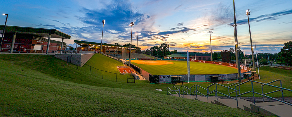 Sunset over the field at Rhoads Stadium