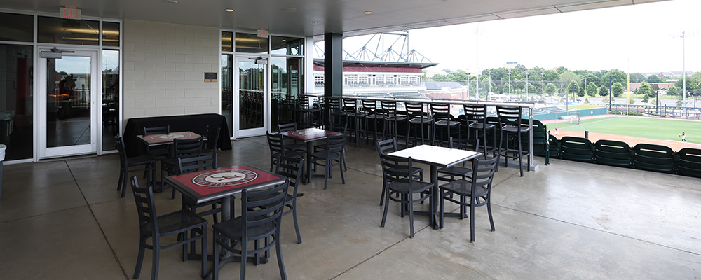 Outdoor square tables on a covered patio