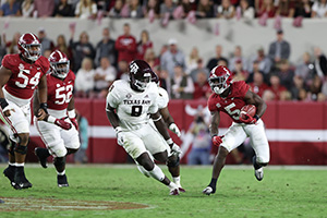 Roydell Williams running the ball down the field