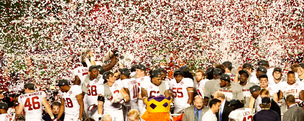 Football team being sprinkled by confetti after National Championship win